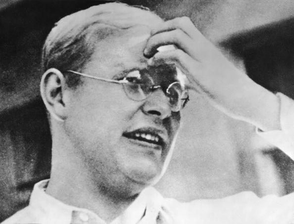 Headshot portrait of German religious leader and resistance participant Dietrich Bonhoeffer (1906 - 1945), who touches his forehead, early to mid 1930s. An outspoken critic of the Nazi regime, the Lutheran pastor and theologian was ultimately hanged at Flossenburg Concentration Camp.