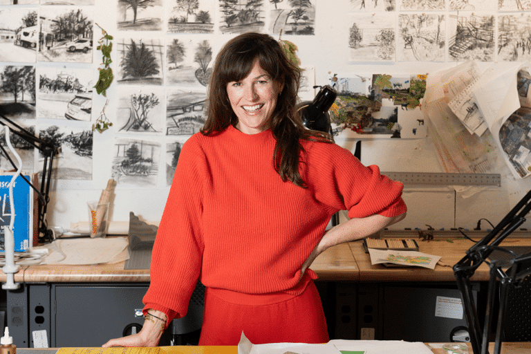 Headshot of Sara Hendren in a student architecture studio.